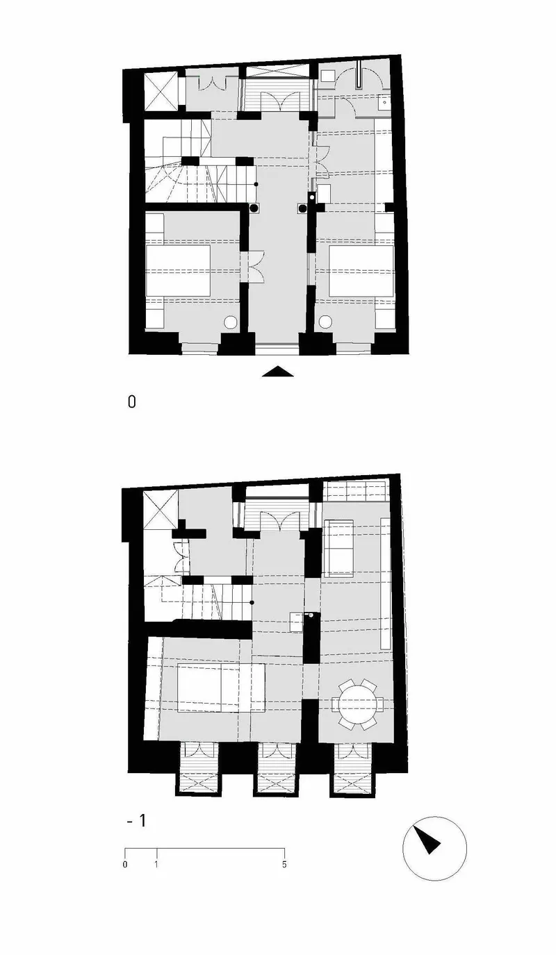 Floor plan drawings showing ground level and basement level with staircase and thick masonry walls
