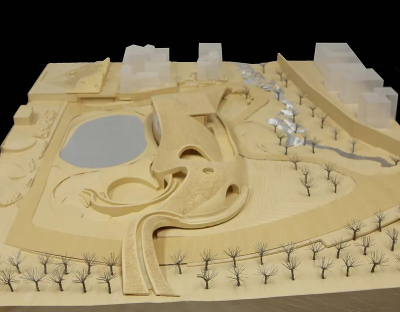 Physical site model showing the flowing roof forms with rows of miniature trees