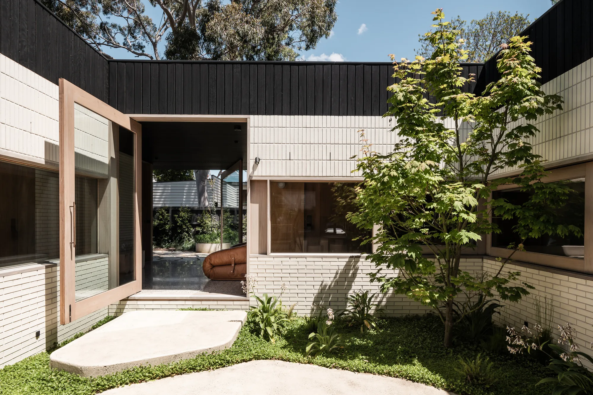 FIGR Architecture Inverts the Suburban Ha-Ha to Build a Fenceless Home in Alphington
