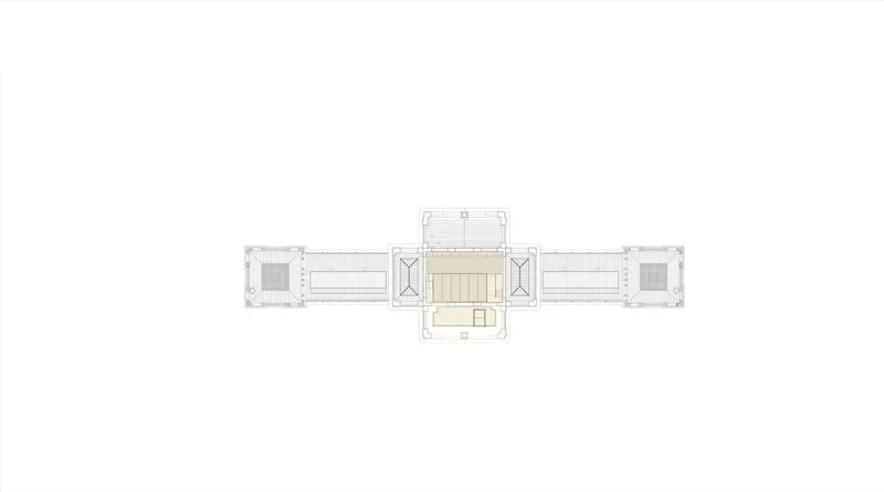 Floor plan drawing showing a central pavilion flanked by symmetrical wings extending to corner towers