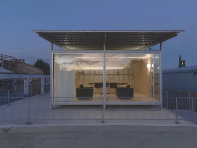 Modulito Estudio and Atelier Industrial Perch a Glass Office on a Disused Wine Pool in Argentina