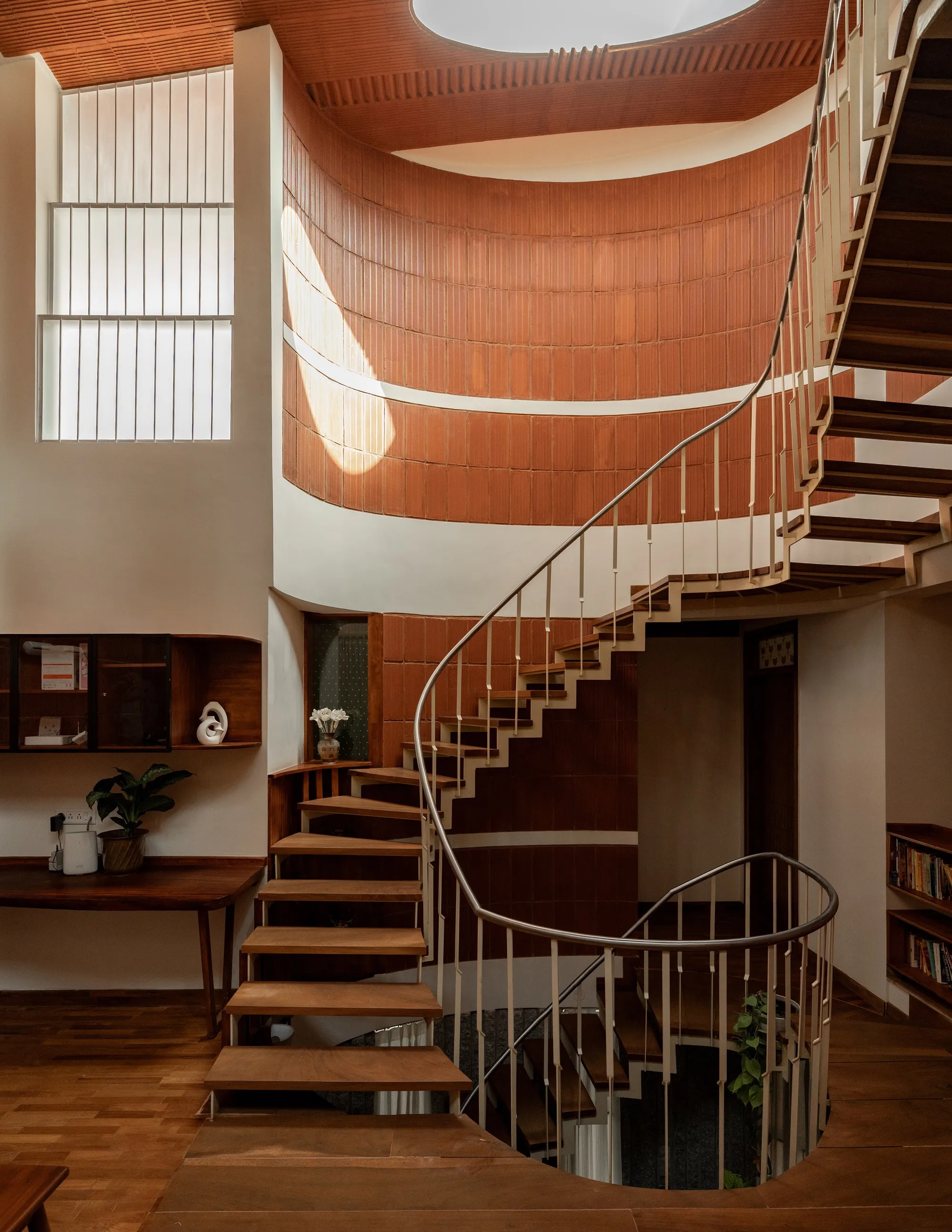 Wright Inspires Channels Tamil Nadu's Traditional Homes into a Bengaluru Residence Built Around a Spiral Stair