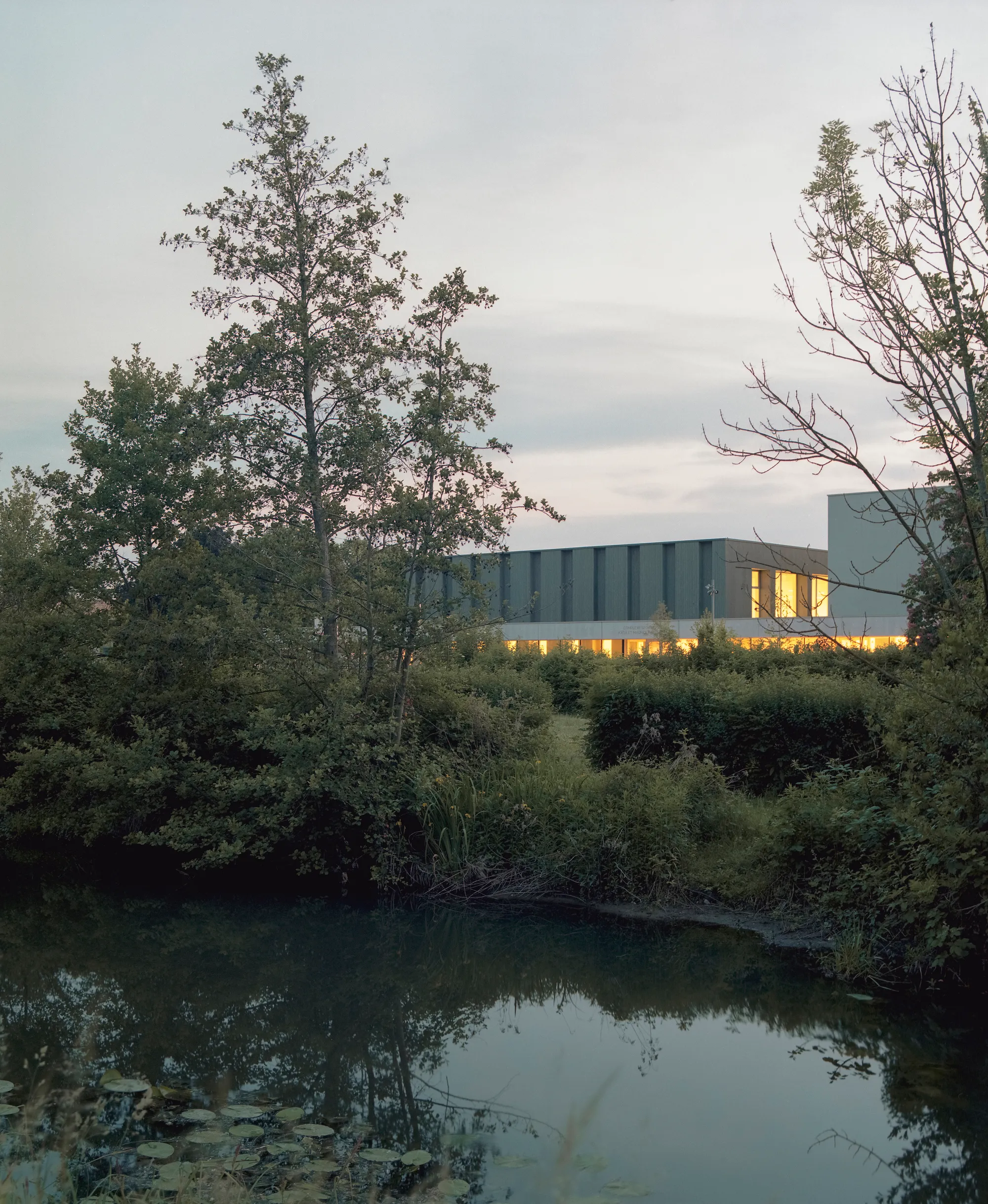 rhb architectes Grafts a Timber-Clad Gymnastics Hall onto a 1981 Sports Complex in Alsace
