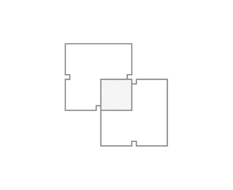 Floor plan drawing showing four rectangular volumes arranged around a central hatched square