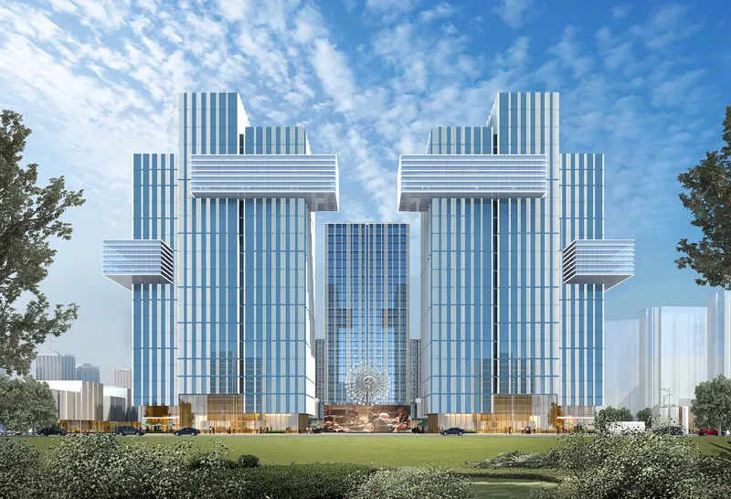 Symmetrical twin towers with vertical white fins and projecting volumes under a partly cloudy sky