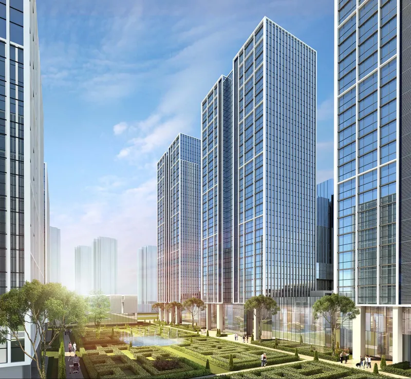 Landscaped courtyard with geometric hedge garden between glass curtain wall towers under blue sky
