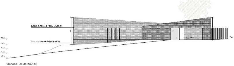 Elevation drawing showing the long brick facade on a sloping grade with vertical window bays