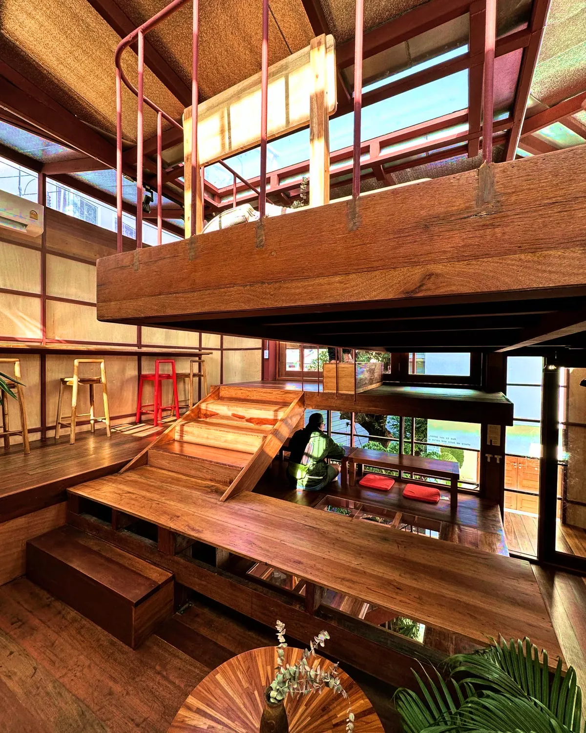 CUP.Scale Studio Stacks a Tree House Café from Salvaged Timber on a 10-Meter Plot in Thailand