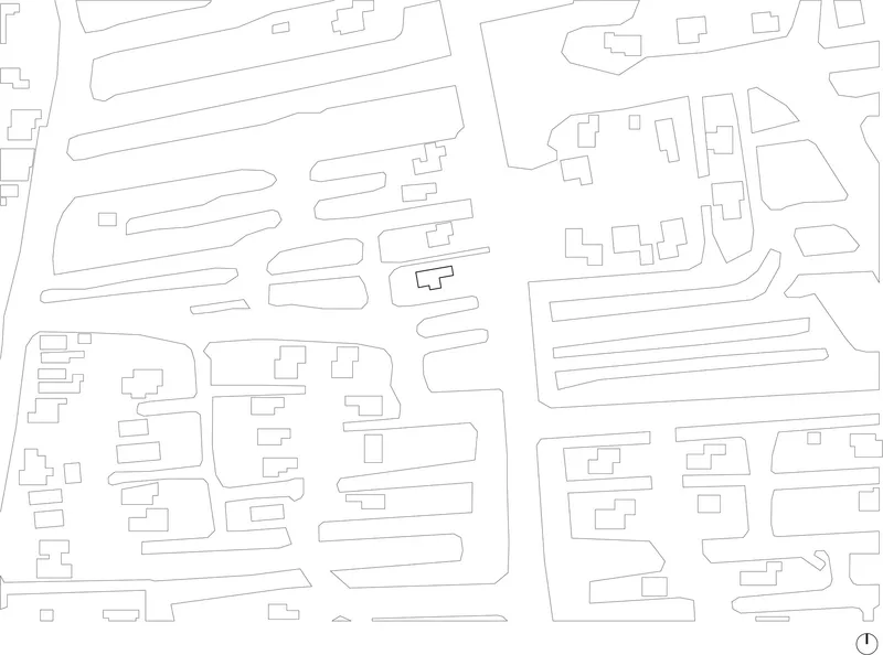 Site plan drawing showing building footprints and street layout in line art