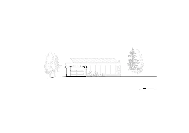 Section drawing showing the sloped roof structure with trees flanking the building profile