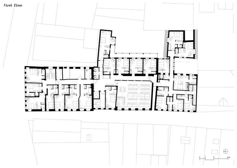 First floor plan drawing showing residential units arranged in a linear corridor configuration