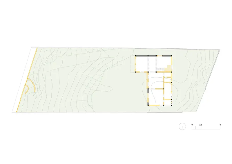 Floor plan drawing showing the building footprint with topographic contour lines on the hillside site