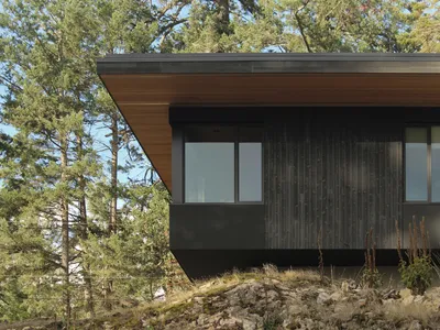 W O V E N Architecture Cantilevers a Charred Timber Retreat Over Salt Spring Island's Rocky Shore
