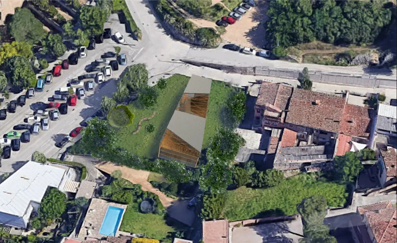 Aerial context showing Biblio placed within Girona’s green urban fabric.