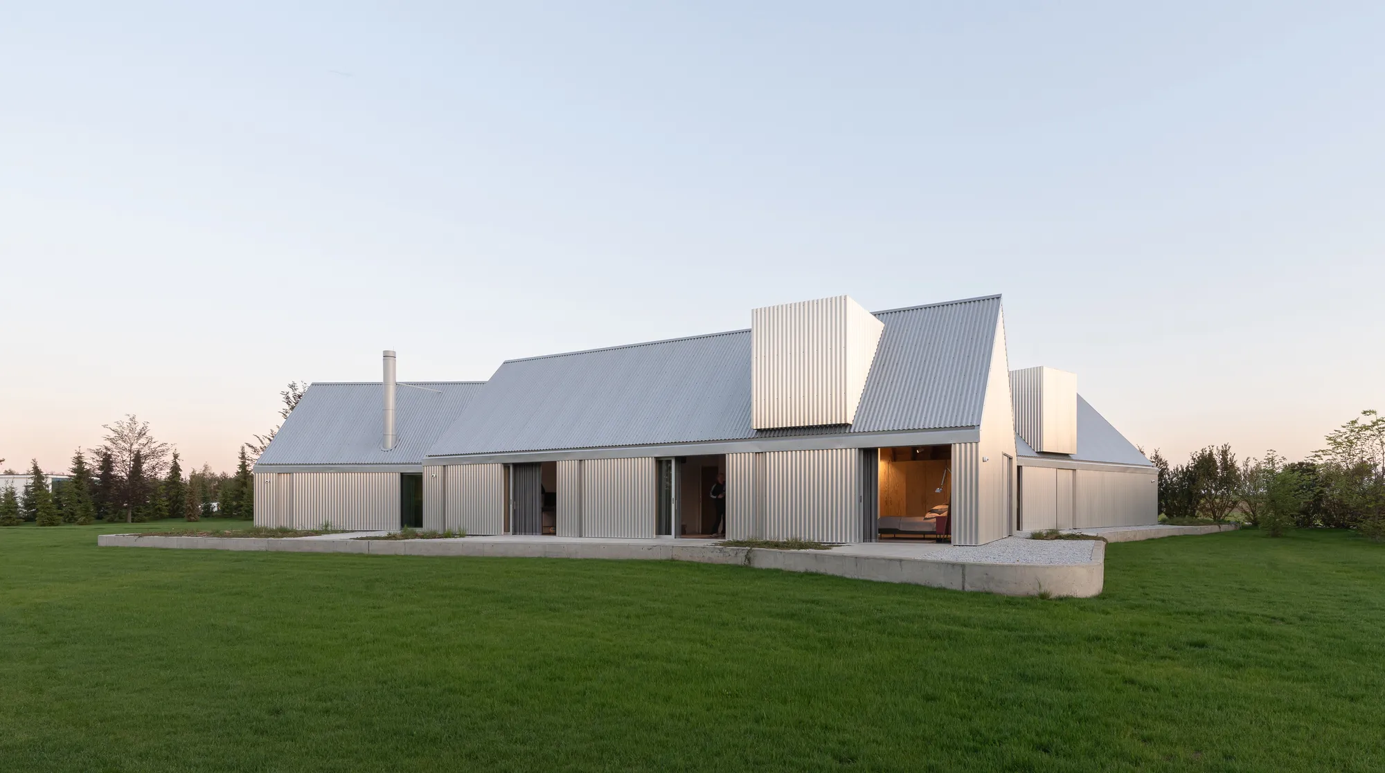 Ultra Architects Disguises a Polish Lakeside Home as a Cluster of Boathouses