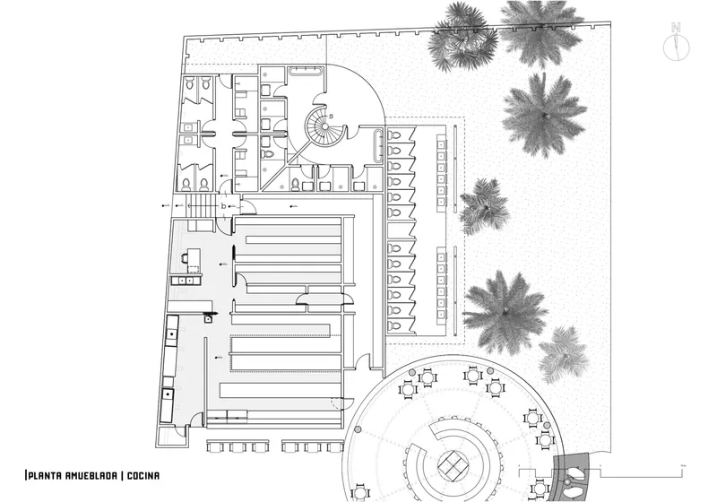 Floor plan drawing showing kitchen and service areas adjacent to a circular bar with palm trees indicated