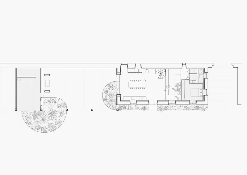 Floor plan drawing of a narrow volume with dining area, courtyard, and planted beds along the perimeter