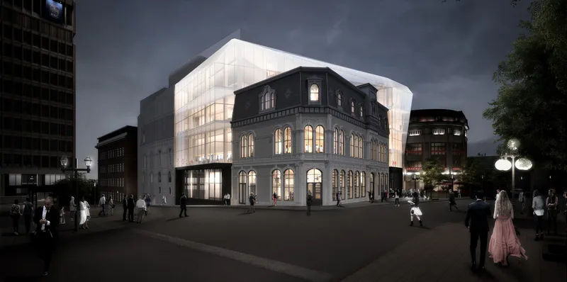 Night rendering of the translucent curved addition rising above a historic arched masonry building with pedestrians in the street