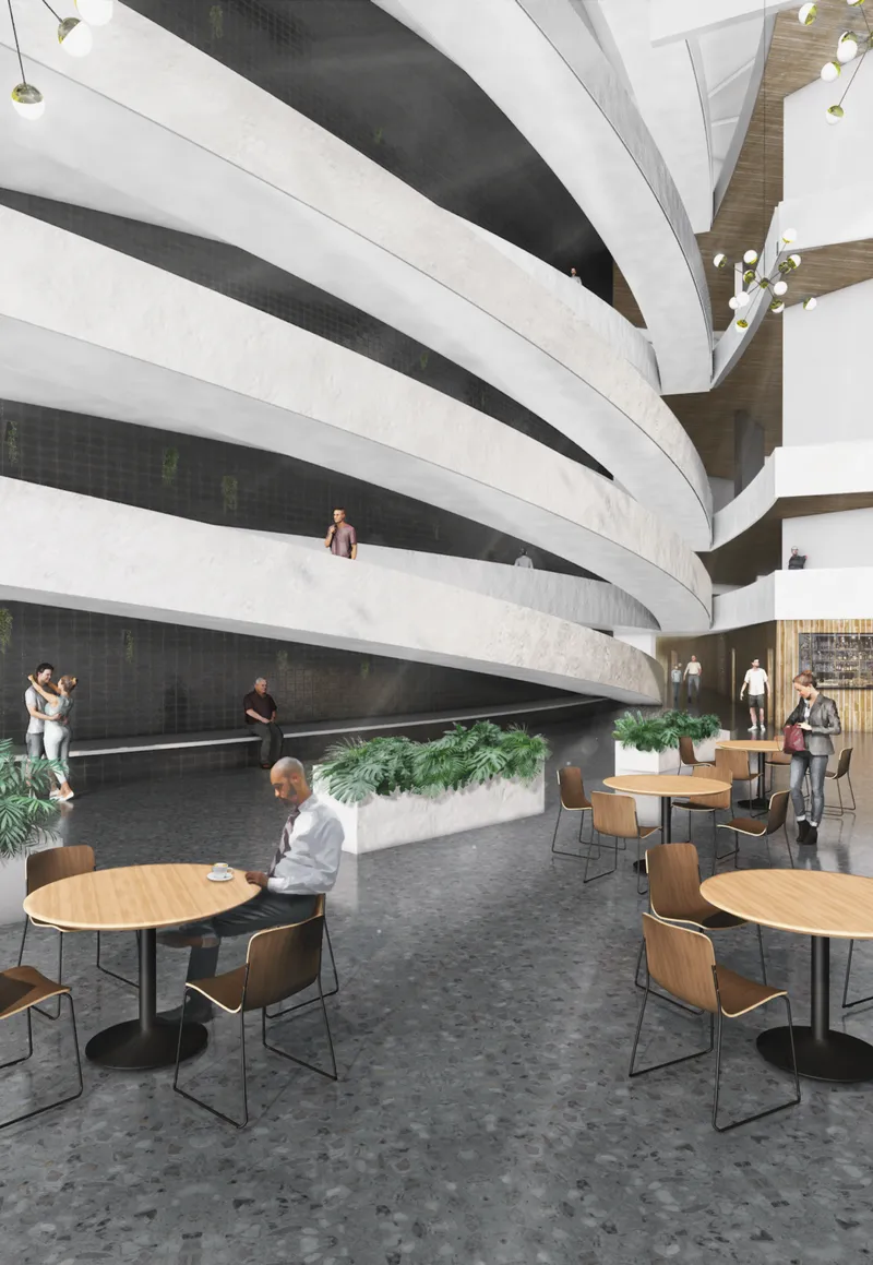 The interior lobby combines curved circulation, public seating, and open gathering spaces.