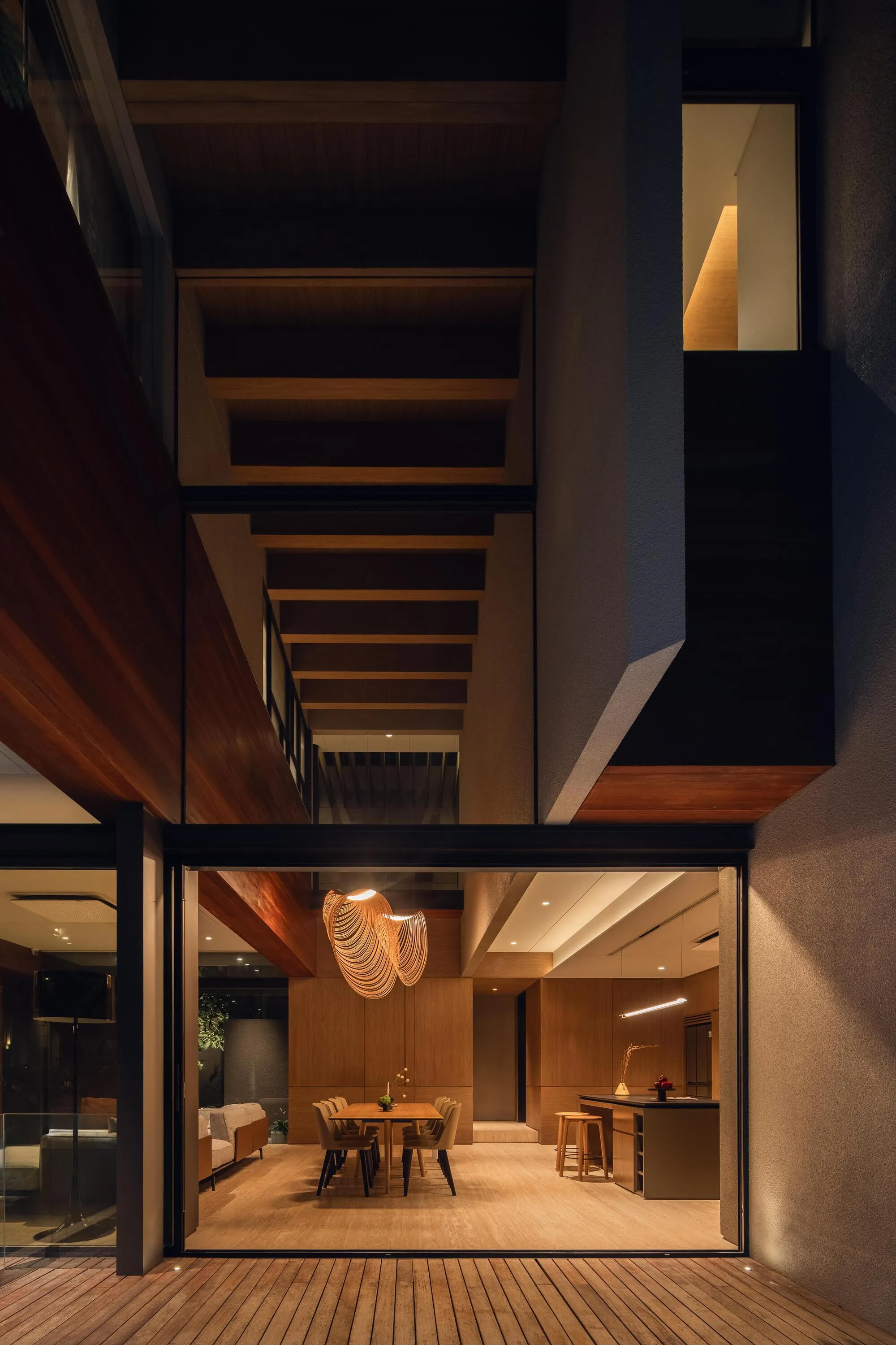 Ken Workshop Wraps a Jakarta Corner Lot in Timber and Stone to Guard Domestic Privacy