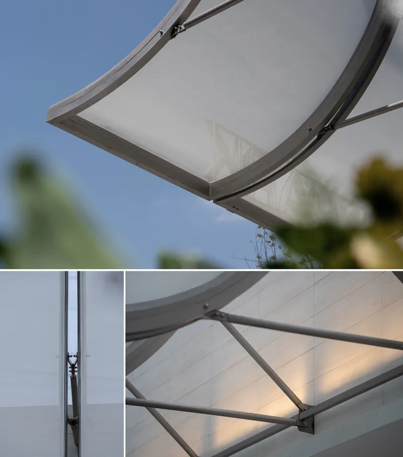 Detail of the tensioned fabric roof edge with metal frame connection and branching support structure below