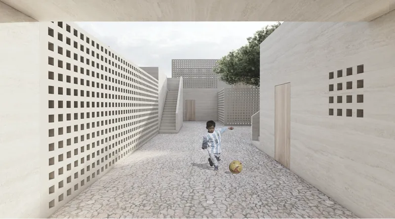A child plays between perforated walls designed for privacy, shade, and natural ventilation.