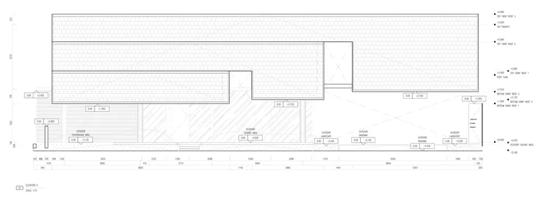 Section drawing illustrating the flat roof planes and interior ceiling heights across multiple volumes