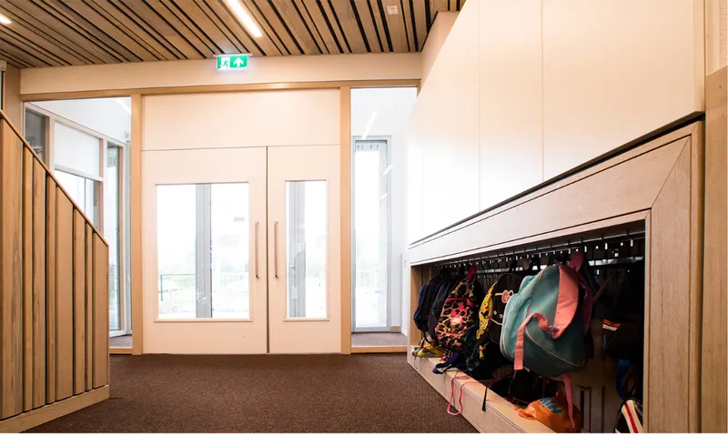 Student storage and timber detailing bring everyday school life into the architecture.