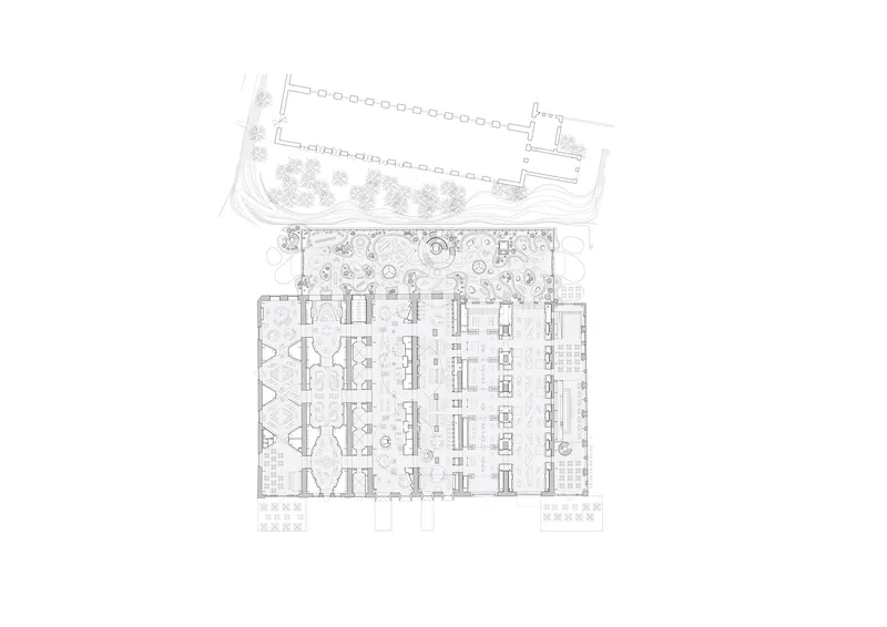 Floor plan drawing showing an interior workspace flanked by a landscaped courtyard and service areas