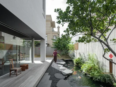 MOZHAO ARCHITECTS Carves Courtyards and Koi Ponds into a Dense Shenzhen Village House