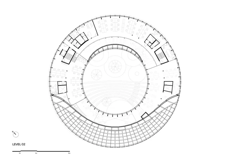 Floor plan drawing of level two with a circular core and tiered seating area along the southern edge