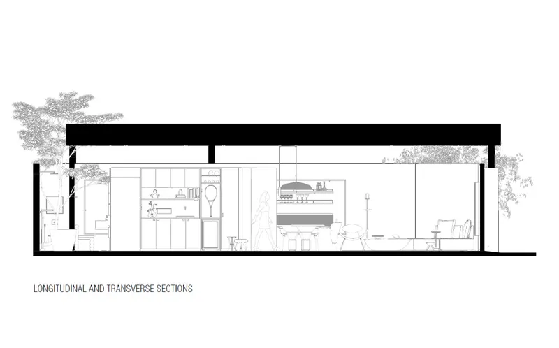 Transverse section drawing revealing bathroom, kitchen bar seating, and bedroom with exterior trees