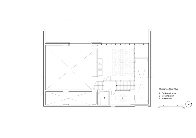 Mezzanine floor plan drawing showing desk work area, meeting room and two staircases