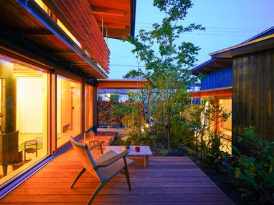 Plan 21 Splits a Toyama Two-Family House into Linked Volumes Around a Shared Courtyard Garden