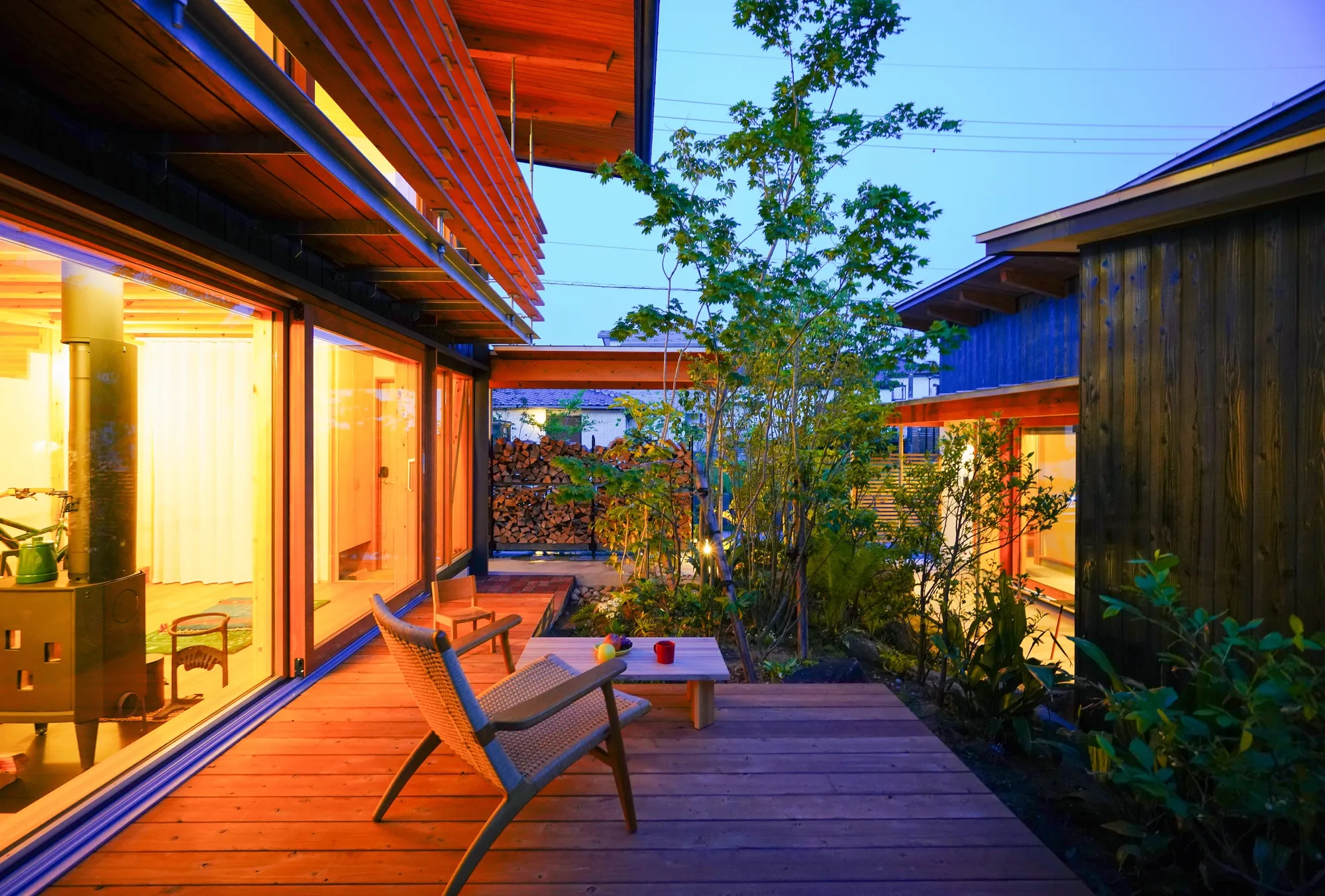 Plan 21 Splits a Toyama Two-Family House into Linked Volumes Around a Shared Courtyard Garden