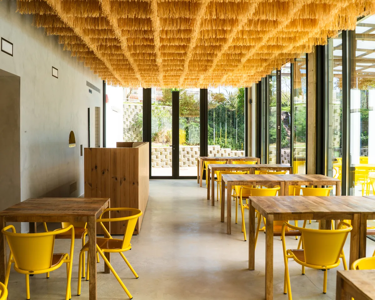 SIA Arquitectura and Gonçalves Perić Turn an Abandoned Municipal Building into a Restaurant for Social Inclusion