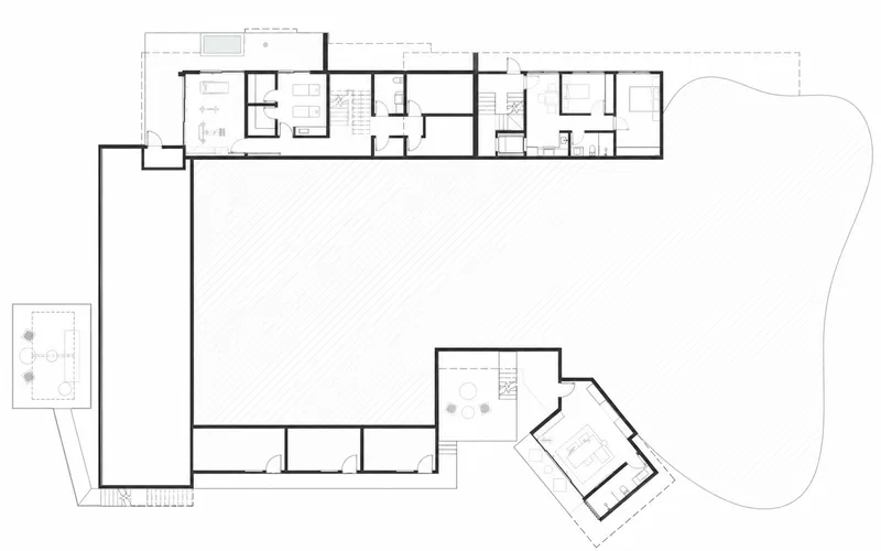 Floor plan drawing showing linear bar of rooms with angled pavilion and pool terrace