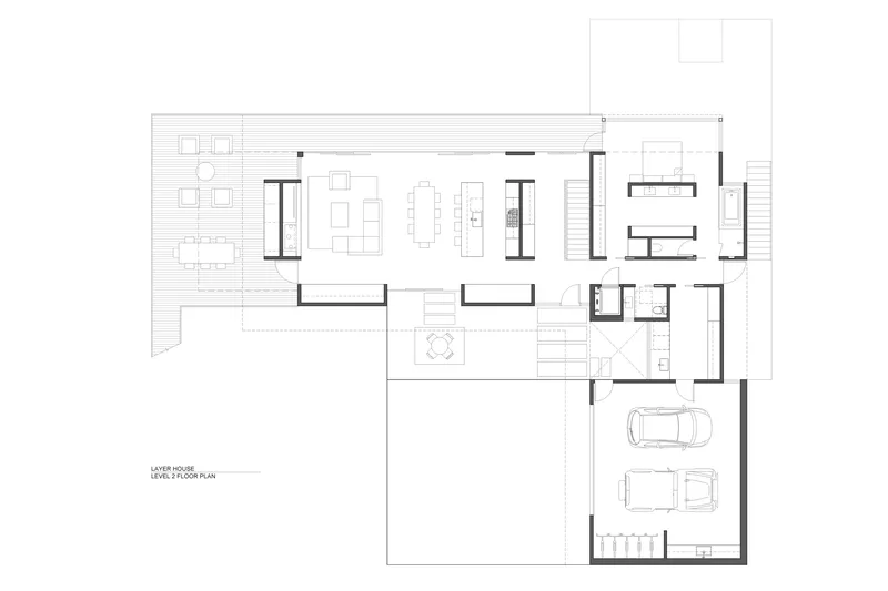 Floor plan drawing showing open living and dining areas with adjacent garage