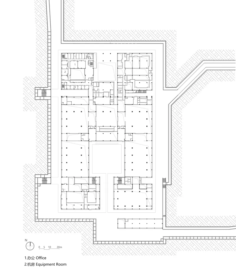 Floor plan drawing showing office spaces and equipment rooms arranged around central courtyards