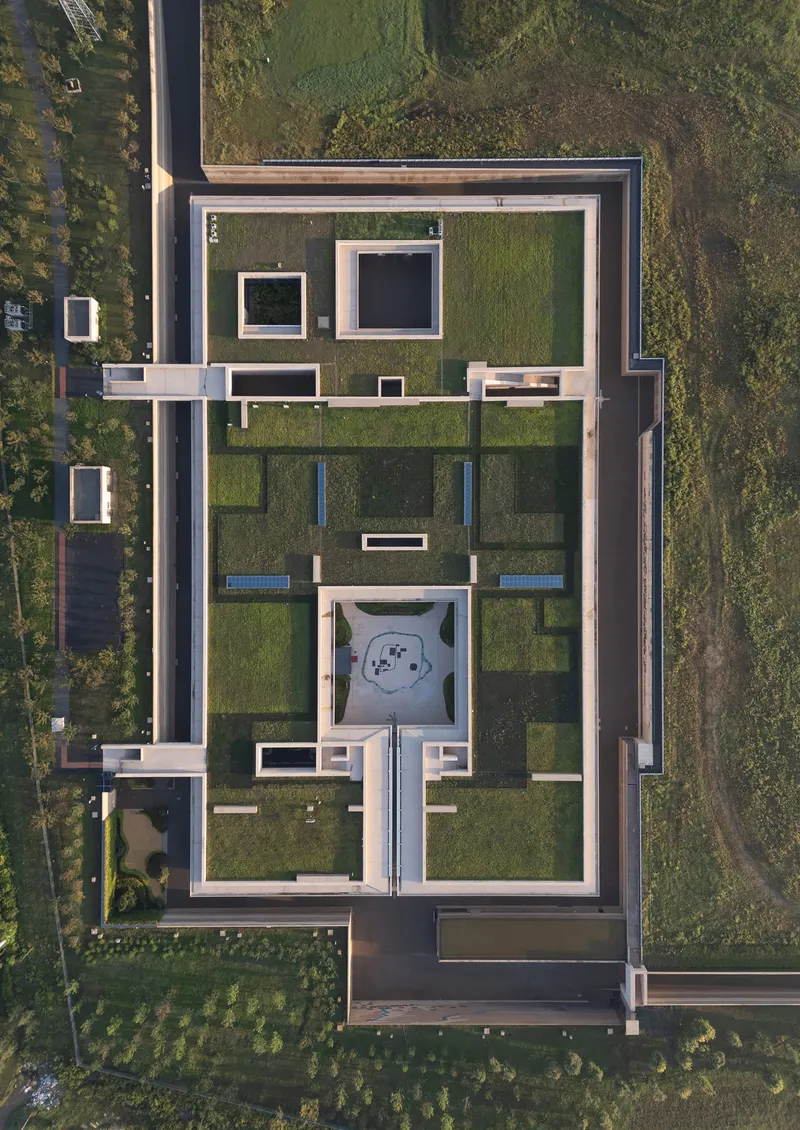 Top-down view showing the gridded layout of courtyards, walls, and water features within the rectangular perimeter