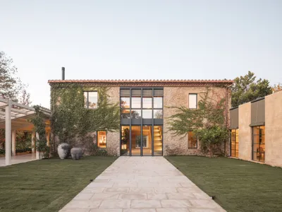 Nordest Arquitectura Carves a Semi-Exterior Core Through a Stone Farmhouse in Catalonia
