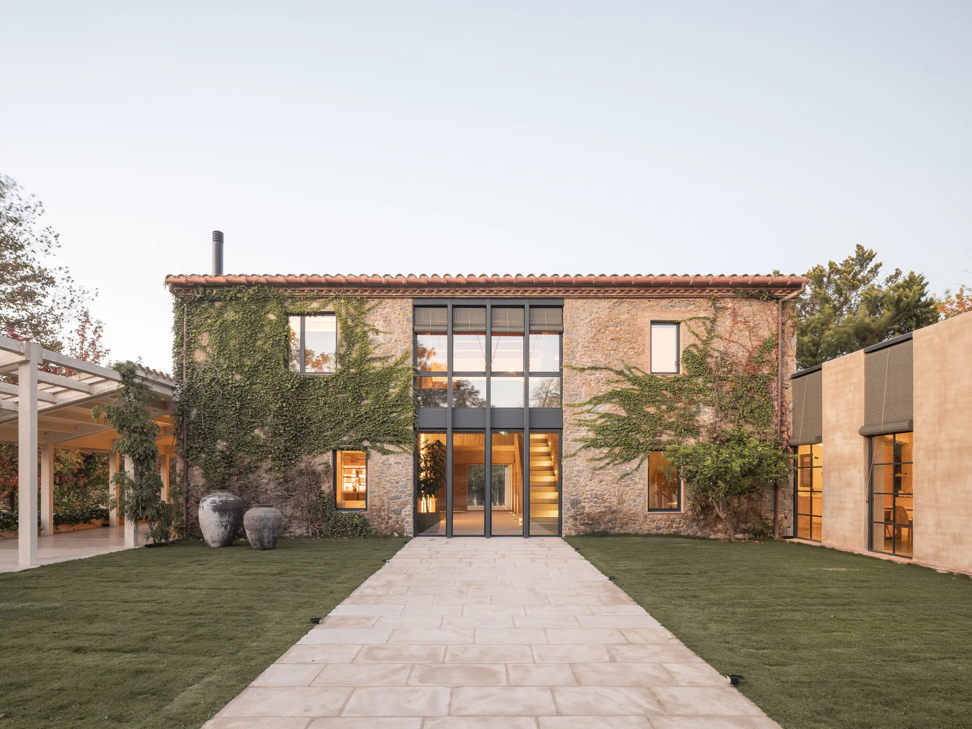 Nordest Arquitectura Carves a Semi-Exterior Core Through a Stone Farmhouse in Catalonia