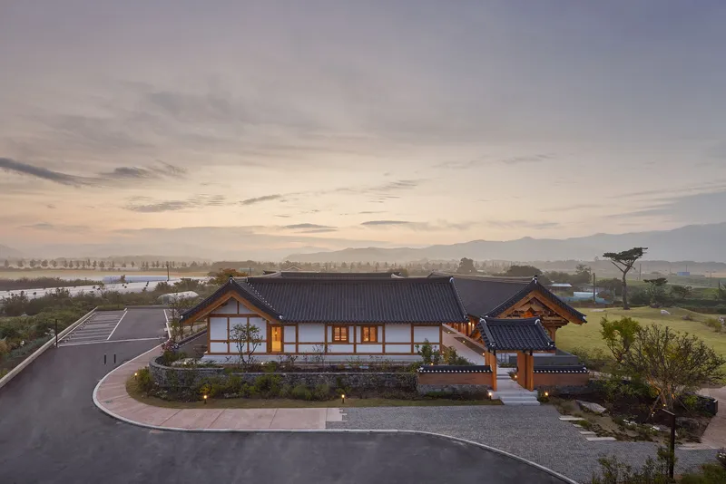 Aerial view of the compound with tiled roofs and courtyard at dawn