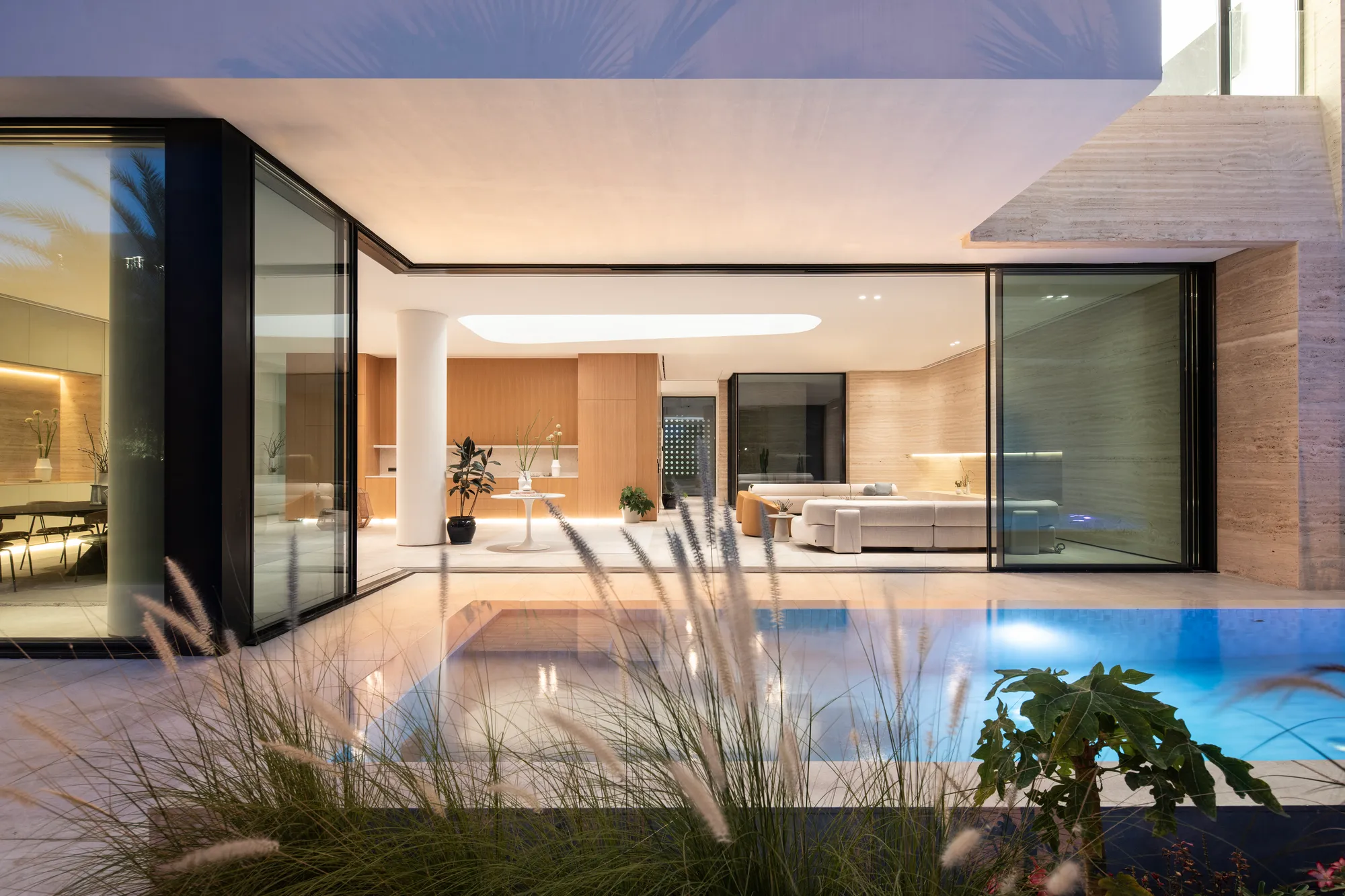Alhumaidhi Architects Builds a Kuwaiti Home Around a Central Void That Pulls Light Through Every Floor