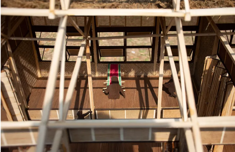 Overhead model view highlighting spatial openness, daylight, and traditional handloom-based learning.