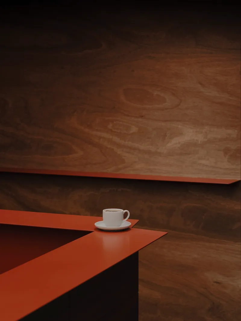 White coffee cup on terracotta counter beneath suspended timber ceiling panel in dim light
