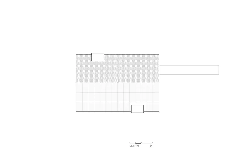 Roof plan drawing showing a rectangular structure with two skylight openings and an attached linear extension