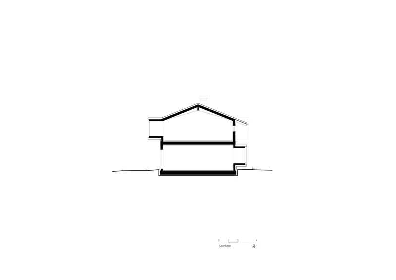 Section drawing revealing a gabled roof structure with two levels stepping down the sloped terrain