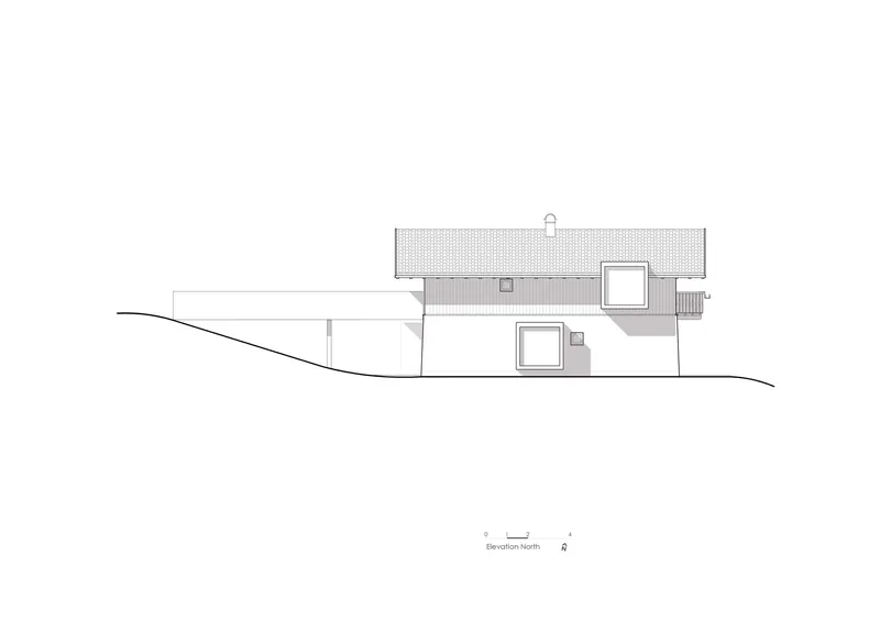 North elevation drawing showing a residence with a gabled roof sitting on sloping ground