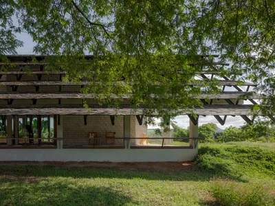 SO Splits a Gable Roof in Two to Let a Tamarind Canopy Define a Thai Farmshop